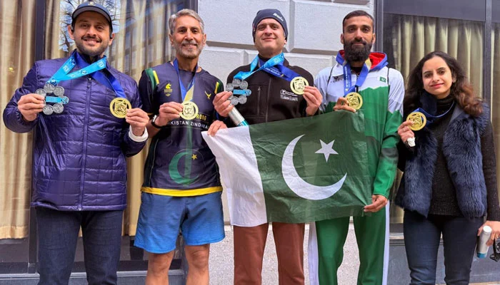 Pakistani runners celebrating at Boston Marathon 2026 finisher line