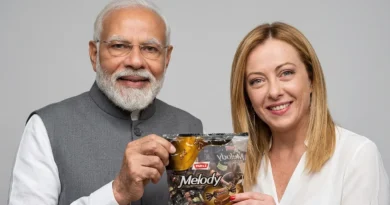 Indian PM Narendra Modi and Italian PM Giorgia Meloni holding a packet of Parle Melody toffee during a meeting
