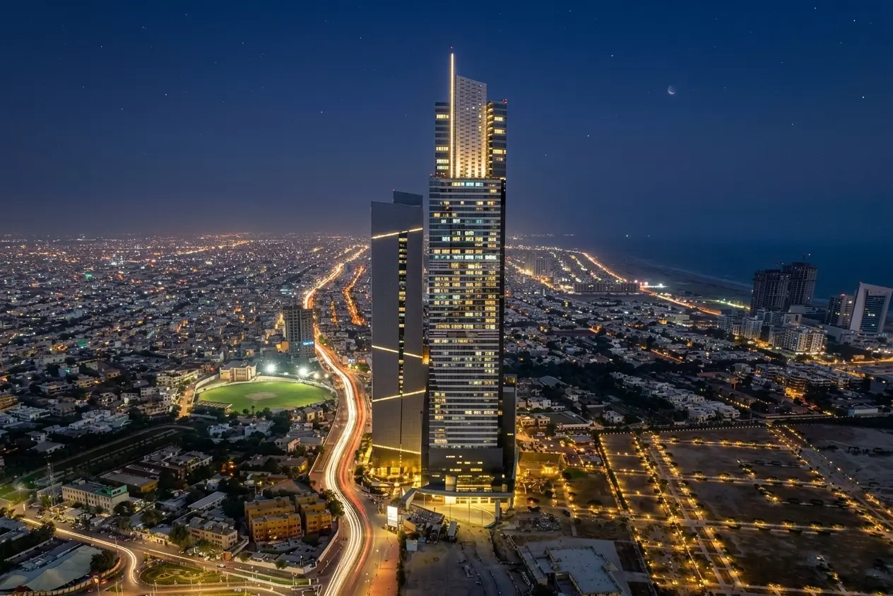 Bahria Icon Tower lit up at night with a stunning panoramic view of Karachi skyline and city lights