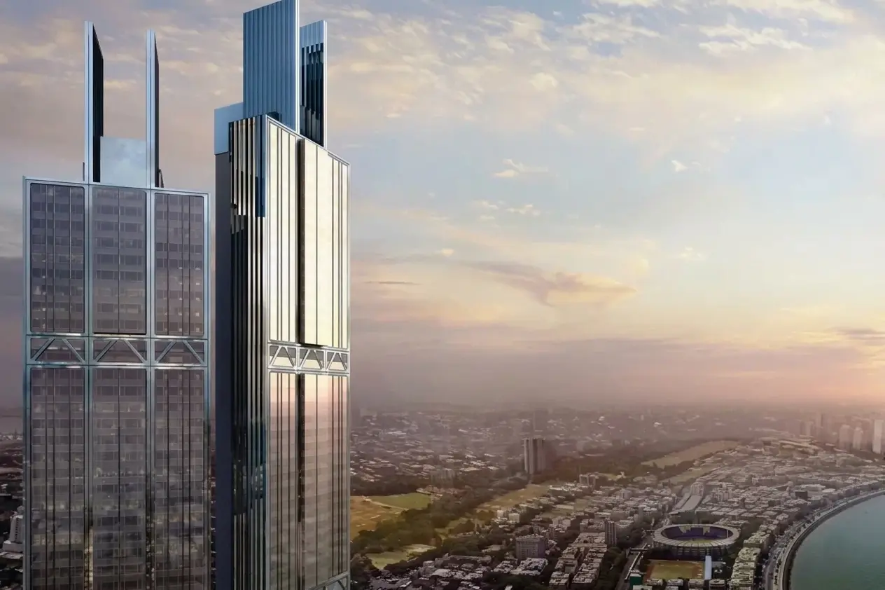 Architectural rendering of Ocean Towers in Karachi during a golden sunset with a panoramic view of the coastline