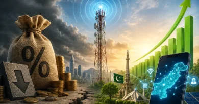 A busy street in Pakistan showing people using mobile phones representing the digital economy and mobile services.