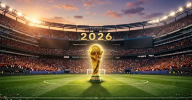 FIFA World Cup trophy placed in the center of a crowded football stadium for the 2026 tournament.
