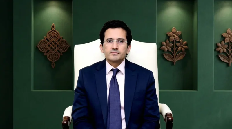 Federal Minister for Petroleum Ali Pervaiz Malik sitting in a professional setting with a green background