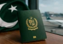A close-up of a green Pakistani passport on a world map, indicating the 101st rank in the Henley Passport Index 2026.