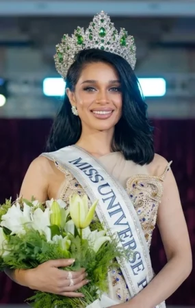 Misbah Arshad holding flowers after winning Miss Universe Pakistan 2026 title in Manila, Philippines