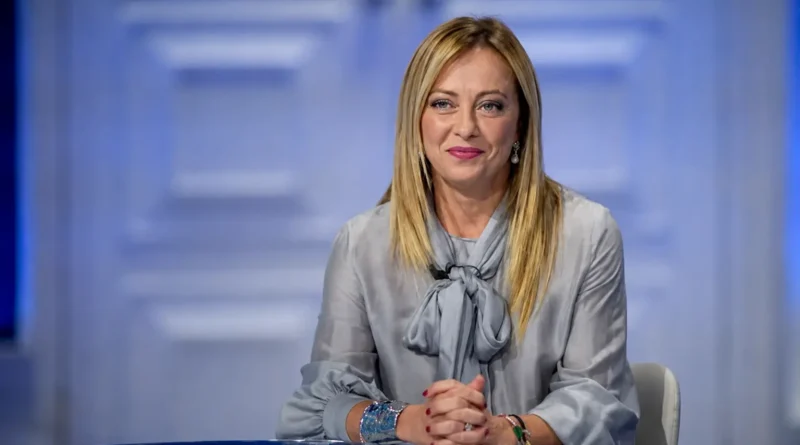 Italian Prime Minister Giorgia Meloni sitting confidently, representing her record-breaking long-term government.
